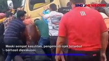 Pengemudi Ojek Online Tersangkut di Kolong Truk, Evakuasi Berlangsung Dramatis