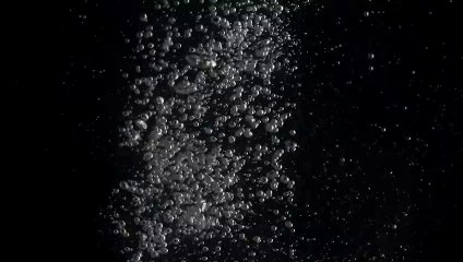 Bubbles rising in water