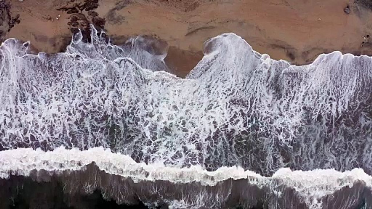 Waves crash on the shore