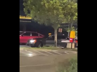 Watch: A fan steals a Travis Scott poster from McDonald's