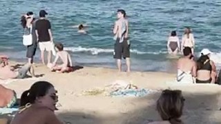 _Sun_bath_at_Barcelona_beach(360p)(1)