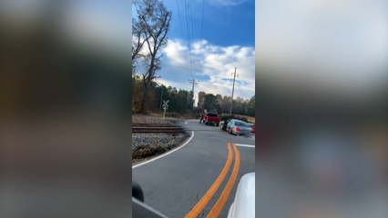 Driver flees seconds before car is hit by train