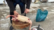 It's snowing heavily, and we're stewing a large goose in an iron pot. It smells so good!