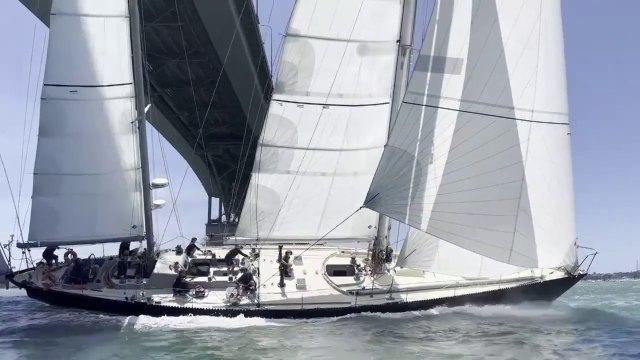 Ocean Globe Race 2024 - Historical Pen Duick VI sail under bridge in Auckland, captured special moment the beauty of sailing