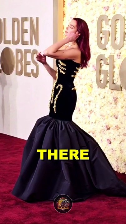 Dua Lipa can’t sit in her dress 