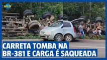 Carreta tomba na BR-381 e carga é saqueada