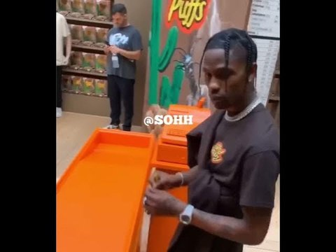 Travis Scott Signs Autographs For Fans At Paris Reese’s Puff Merch Collab Pop-Up Shop