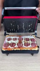 I don't buy pizza anymore! Now I make it at home on the sandwich maker!