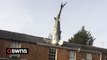Owner of famous house with 25ft shark sticking out of the roof booted off Airbnb