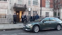 Queen Camilla smiles as she leaves hospital after visiting King Charles