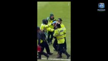 Police arrest six as 'inexcusable' violence erupts at FA Cup derby between West Brom and Wolves - fans storm the pitch, 'missiles' thrown and frantic players rescue their children