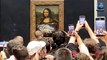 Police Arrest Two People after Ranting Eco-Morons Attacked Mona Lisa in the Louvre by Throwing Soup