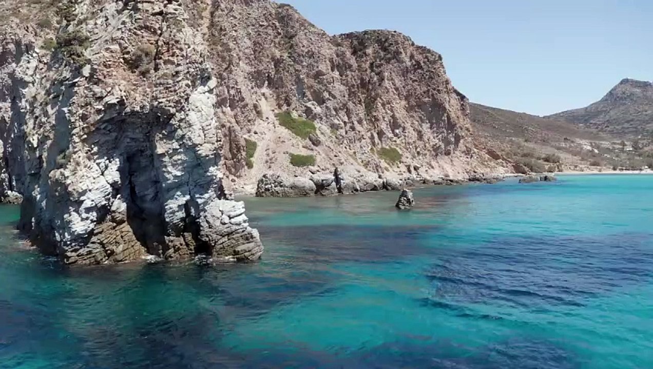 Rocky shoreline with a turquoise blue sea