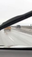 Convertible With Its Top Down in a Freezing Rain Storm