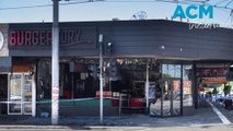 Two men charged over Burger store blaze in Victoria