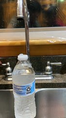 Laminar Flow Creates Water Bottle Waterfall