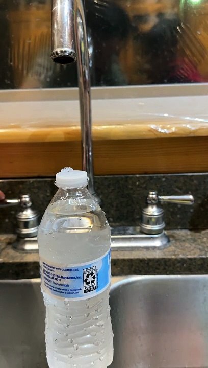 Laminar Flow Creates Water Bottle Waterfall
