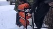 Man Helping Woman Carry Rack Loses Footing and Falls on Icy Stairs in Oregon, USA