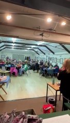 Ruth Thrush leads the singing of her bingo song in Withycombe Memorial Hall.
