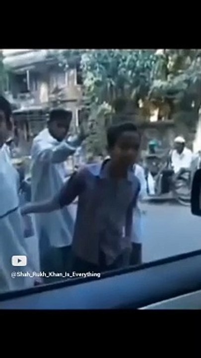 Shah Rukh Khan drives a car