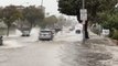 Cars drive through submerged roads amid ‘life-threatening’ flooding in San Francisco