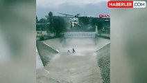 ABD'de yoğun yağış ve rüzgarlar köpeği kurtarmak için su kanalına atlayan kişi helikopterle kurtarıldı