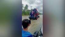 Tractor evacuation saves stranded residents from floods in Philippines