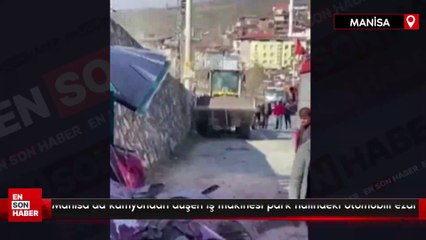 Manisa’da kamyondan düşen iş makinesi park halindeki otomobili ezdi