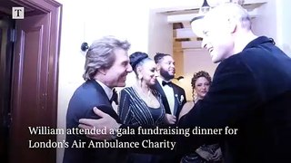 William greets Tom Cruise at gala dinner for Air Ambulances