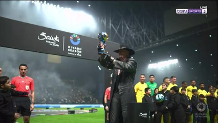 The Undertaker holds aloft the Riyadh Season Cup