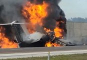 Plane crash lands on Florida highway and bursts into flames