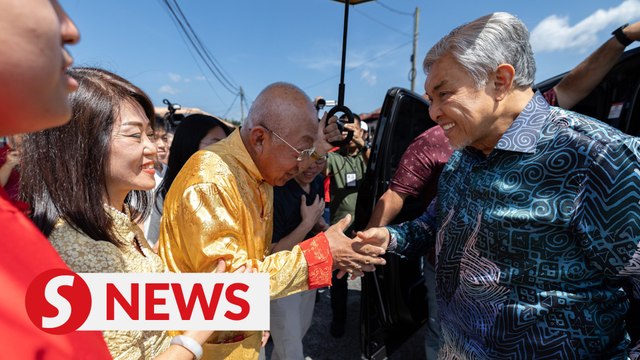 Ahmad Zahid visits adopted family on CNY