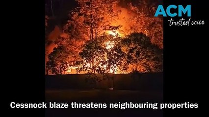 Backyard blaze threatens neighbouring homes