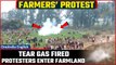Farmers’ Protest: Amid Tear gas being fired by Police, protesting farmers enter Farmland | Oneindia
