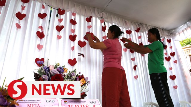 Bali voters cast ballots in Valentine's Day-themed polling station