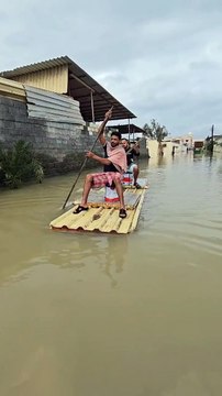 UAE residents construct makeshift boats to move around on flooded roads