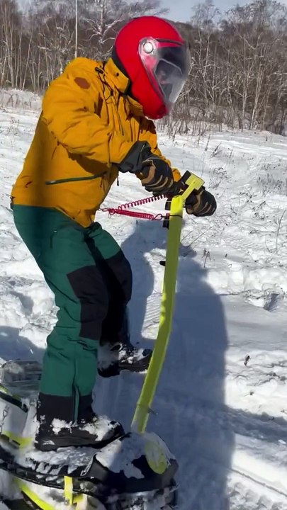 Electric Snowboards Cruise Up and Down Snowy Hill