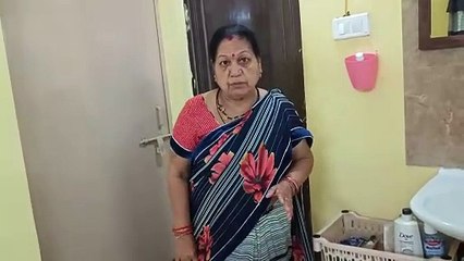 The woman, who was trying to open the door to go to the bathroom