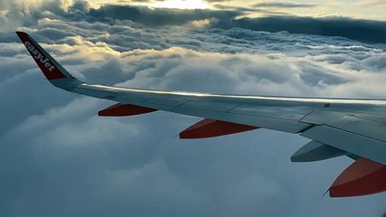 Airplane above the clouds