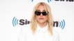 Kesha has claimed she is still not 'free' to release new music