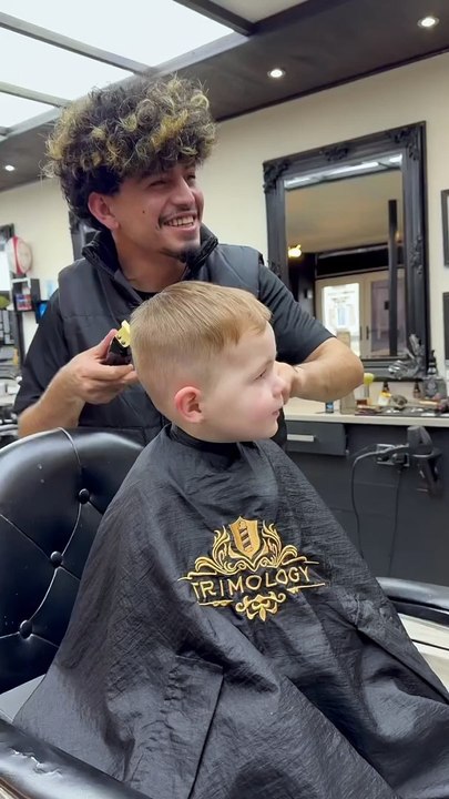 Kid Laughs Uncontrollably While Getting a Haircut