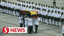 Taib's remains arrive in Kuching, given 17-gun salute