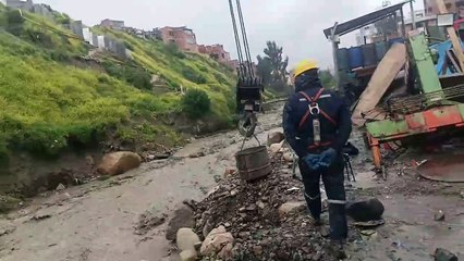 Workers Rescue Dog From Raging River