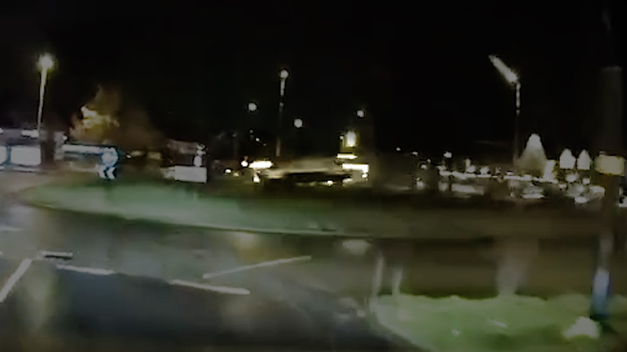 Moment speeding car flies over roundabout