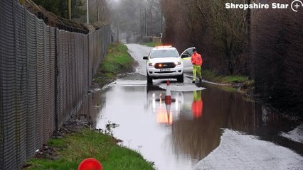 The scene along Long Lane, Shifnal, where a huge pothole hidden by floodwater has wrecked a number of cars.