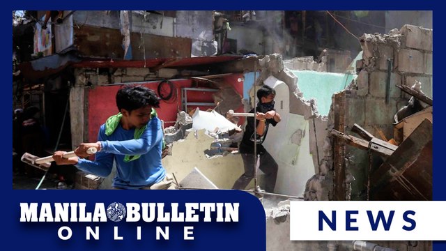 Demolition team destroys houses in Brgy. Sto. Domingo, Quezon City