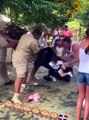 Woman drops her baby, as she gets a monkey off her head