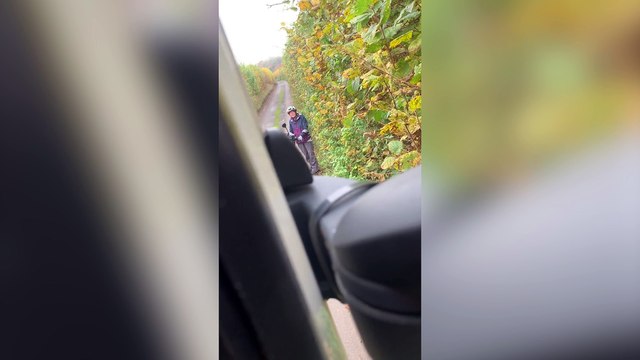 Standoff between lorry driver and cyclist in country lane
