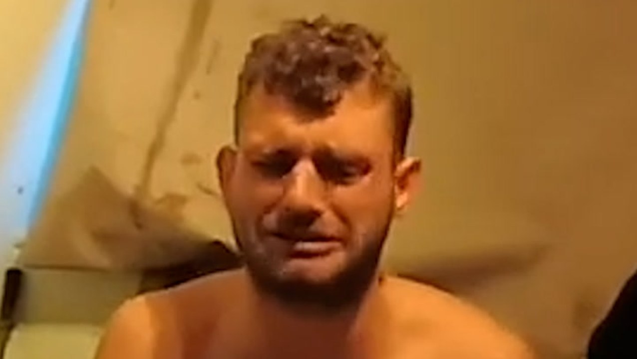 Topless man cries after police catch him throwing drugs over garden fence