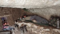 Alone in the mountains, using the cliffs as shelter.